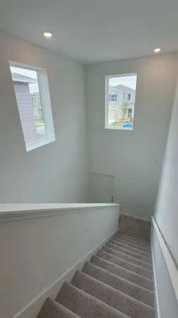 a view of a hallway with staircase