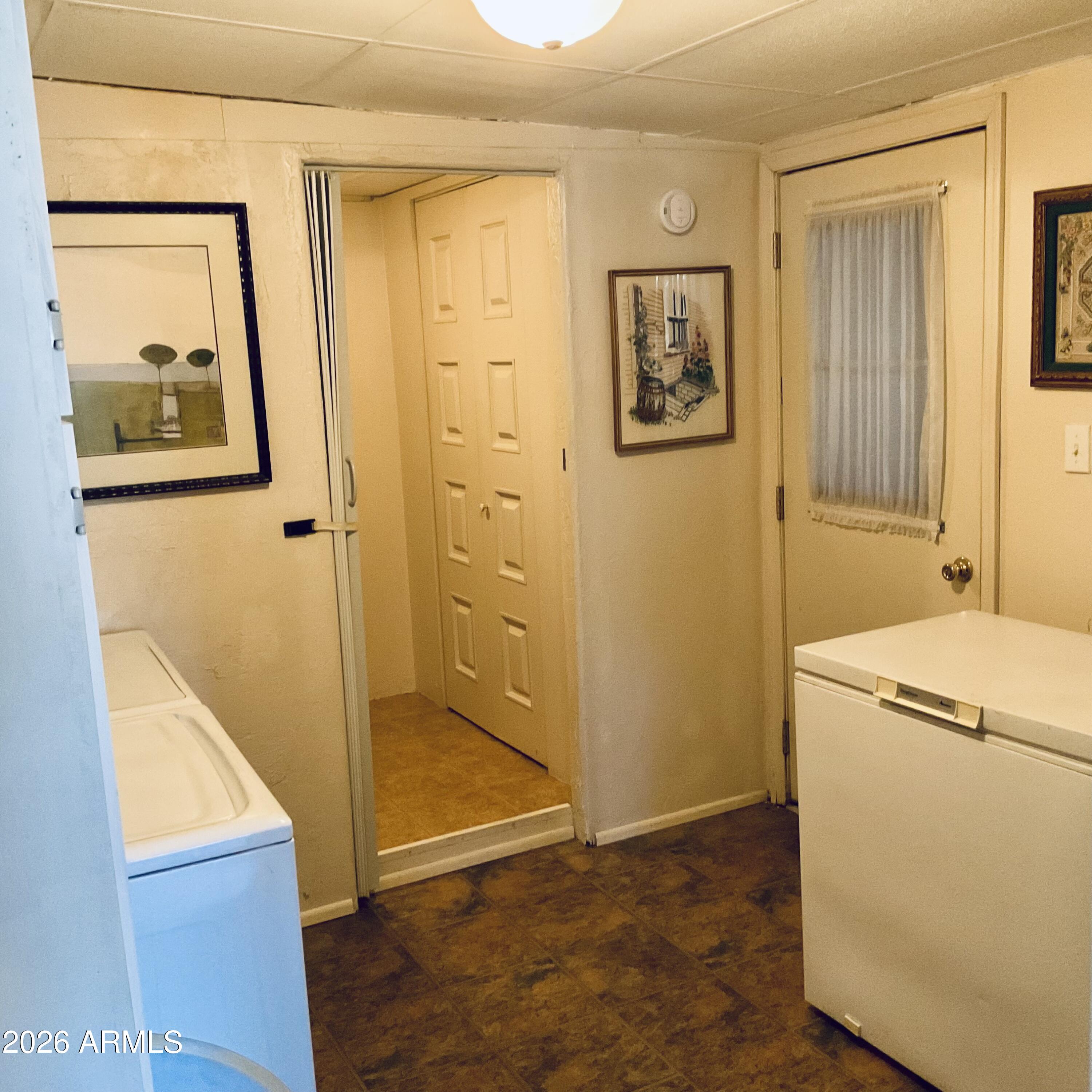 3036 East Utopia Road, Unit 52 Phoenix, AZ 85050 - Photo 21 of 36 Laundry room to half bathroom