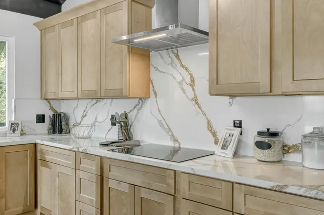 a spacious bedroom with a large bed and a large window