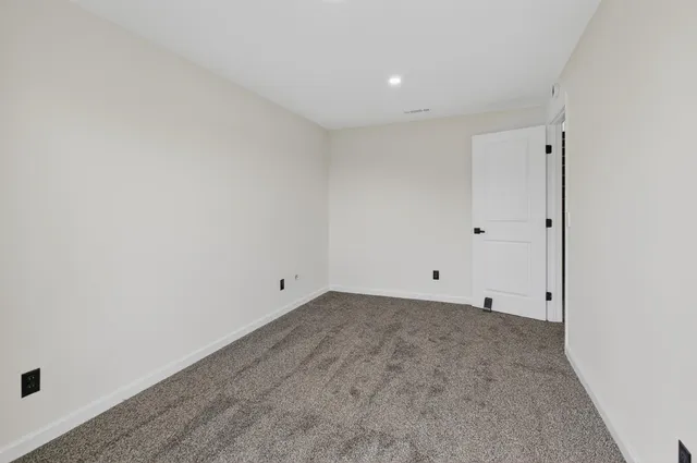 a balcony with wooden floor and fence