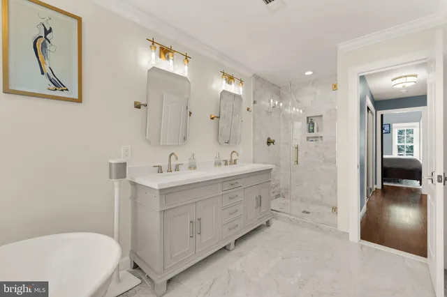 a bathroom with a double vanity sink a toilet and a mirror