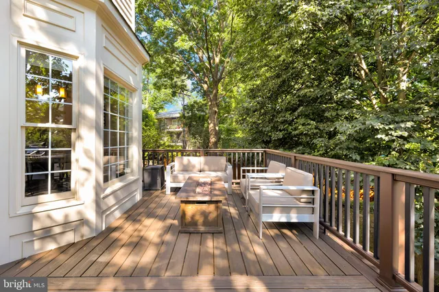 a balcony with wooden floor and outdoor space
