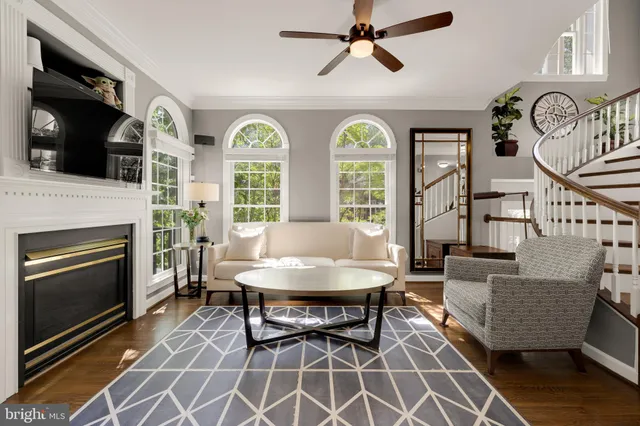a view of a livingroom with furniture and a fireplace