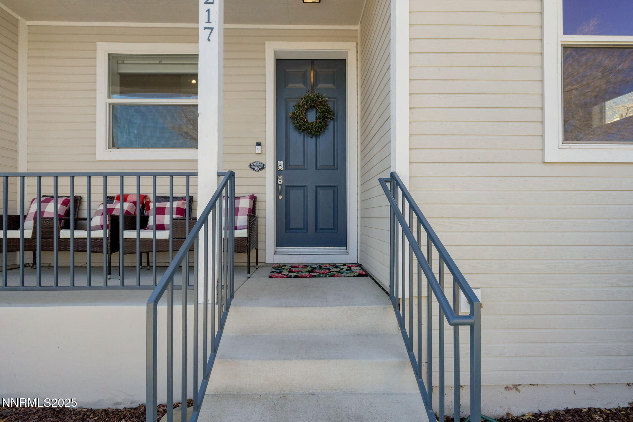 1217 Lander Street Reno, NV 89509 - Photo 2 of 20 a view of staircase with railing and a chandelier