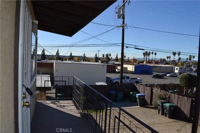 a view of a chairs and table in a balcony
