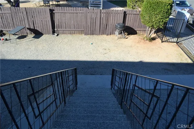 a view of outdoor space with wooden deck and furniture