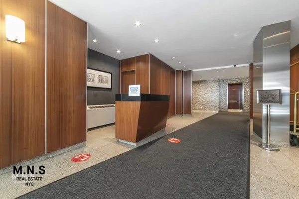 a view of a storage & utility room with cabinets