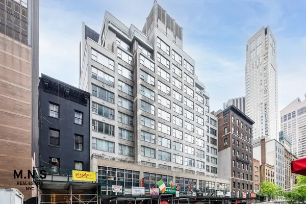 a view of a storage & utility room with cabinets