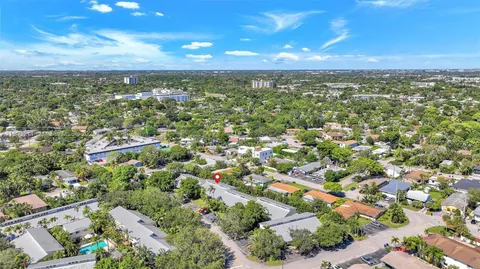 an aerial view of residential houses with city view