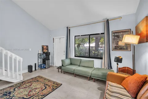 a living room with furniture and a rug