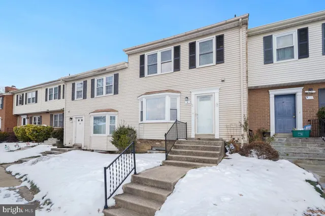 a front view of a house with glass windows