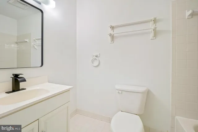 a bathroom with a toilet sink and shower