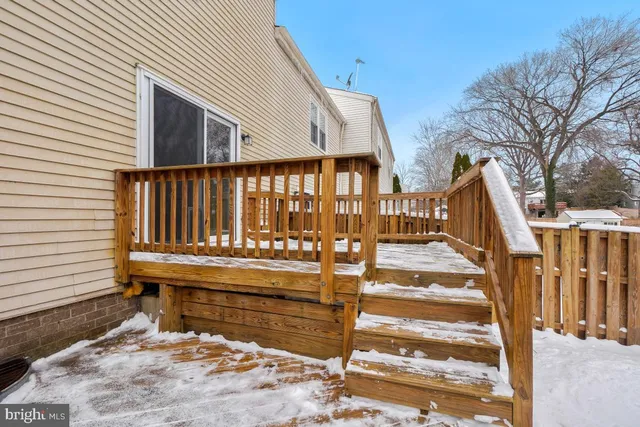 a view of entryway with wooden stairs