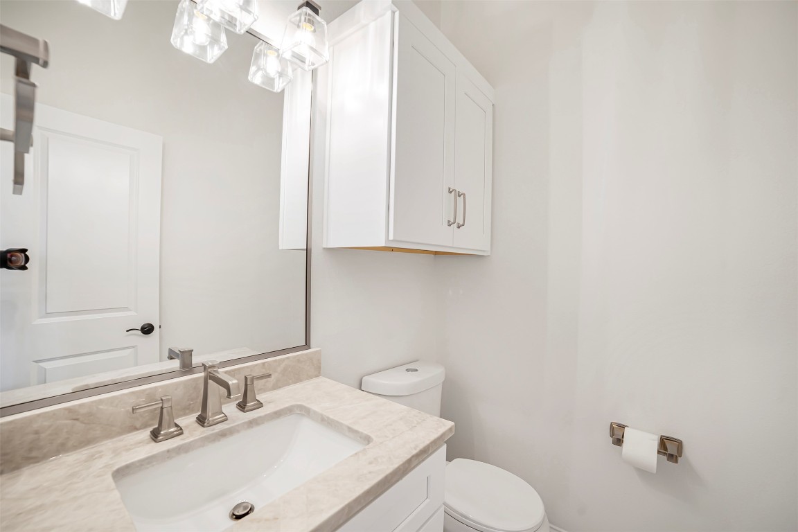 10903 Centennial Trail Austin, TX 78726 - Photo 13 of 31 Half bath near kitchen, living room and laundry room