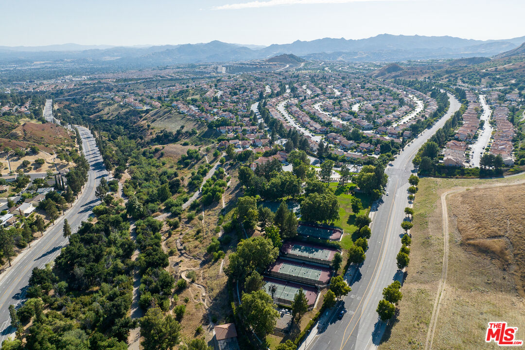 19584 Shadow Ridge Way Porter Ranch, CA 91326 - Photo 2 of 4 an aerial view of residential houses with outdoor space