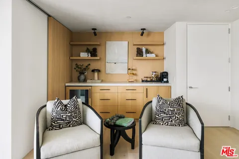 a living room with fireplace furniture and a flat screen tv