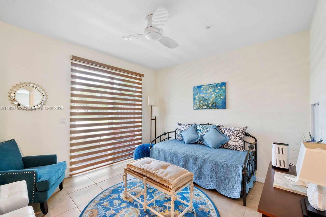 2851 Prospect Road, Unit 1306 Tamarac, FL 33309 - Photo 12 of 39 a living room with furniture and a window