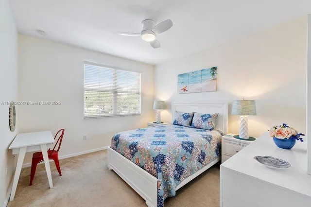 a bedroom with a bed and a table in it