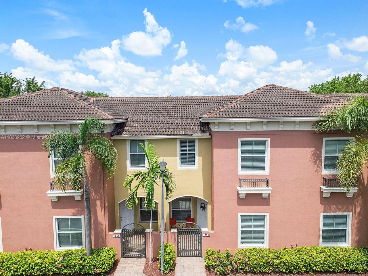 2851 Prospect Road, Unit 1306 Tamarac, FL 33309 - Photo 2 of 39 front view of house with a yard