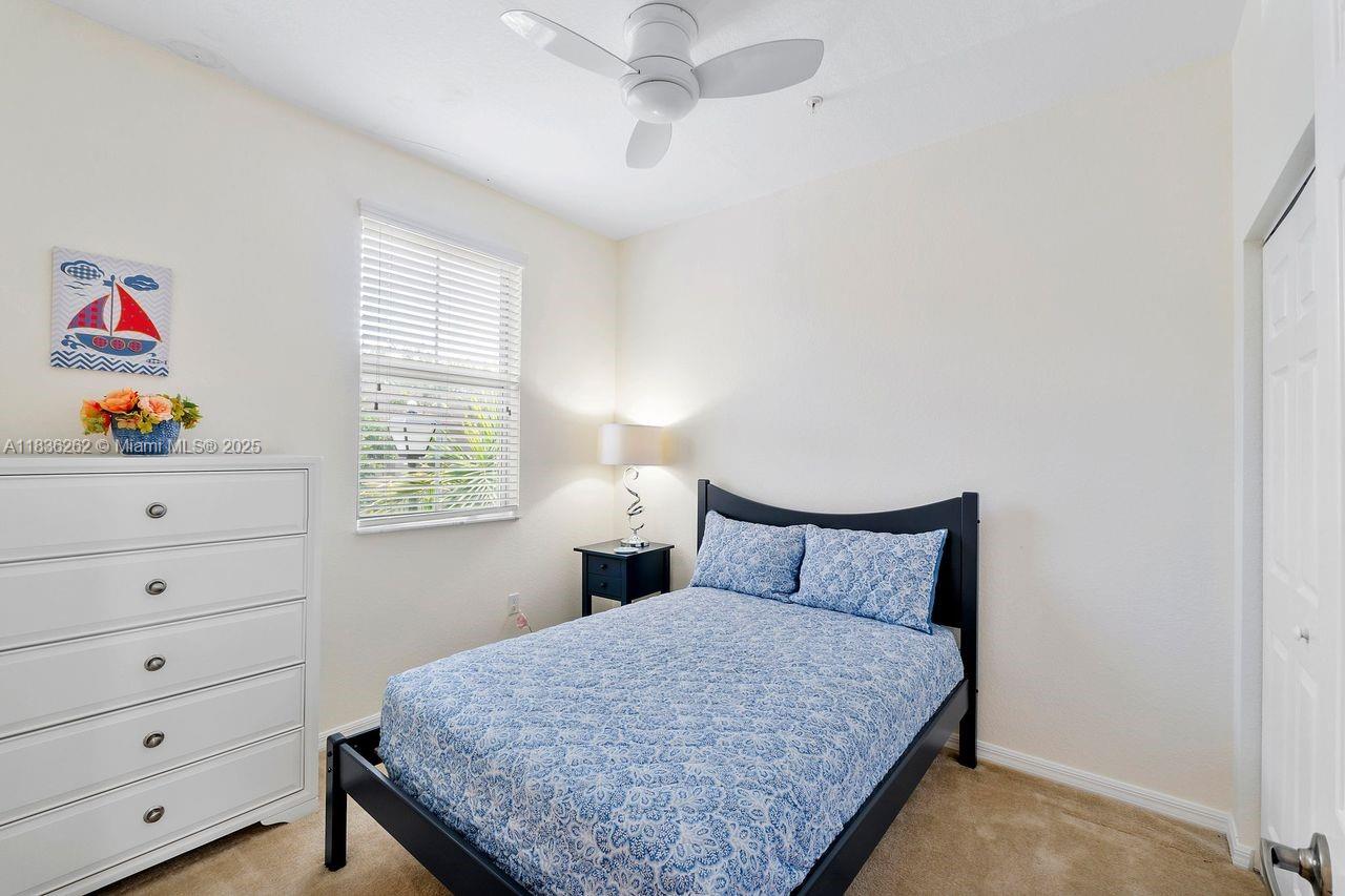 2851 Prospect Road, Unit 1306 Tamarac, FL 33309 - Photo 24 of 39 a bedroom with a bed and a window