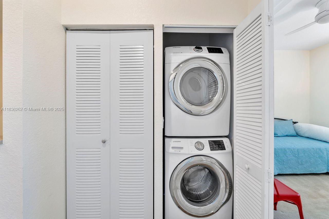 2851 Prospect Road, Unit 1306 Tamarac, FL 33309 - Photo 27 of 39 a utility room with dryer and washer
