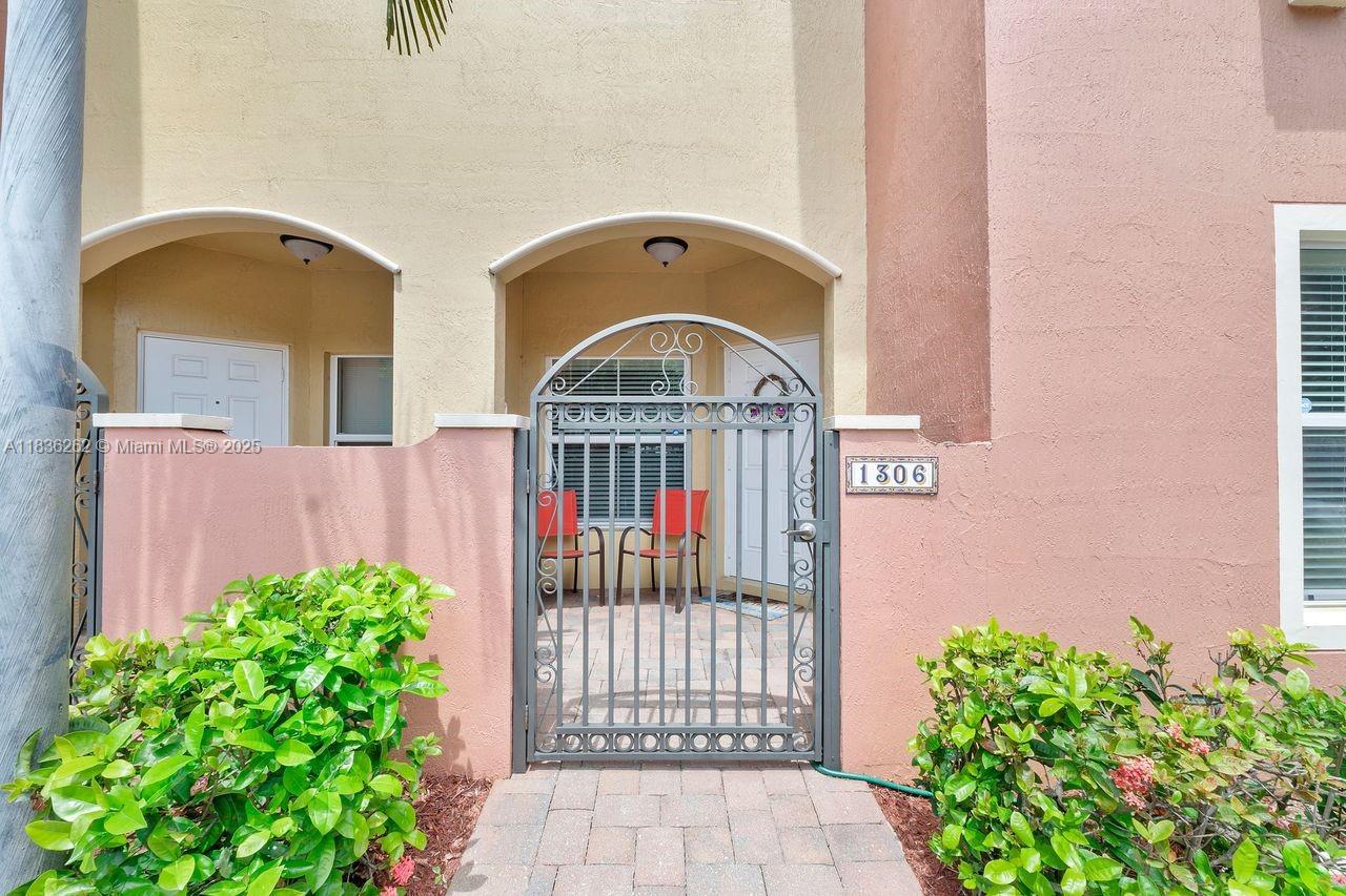 2851 Prospect Road, Unit 1306 Tamarac, FL 33309 - Photo 30 of 39 a view of a entrance gate of the house