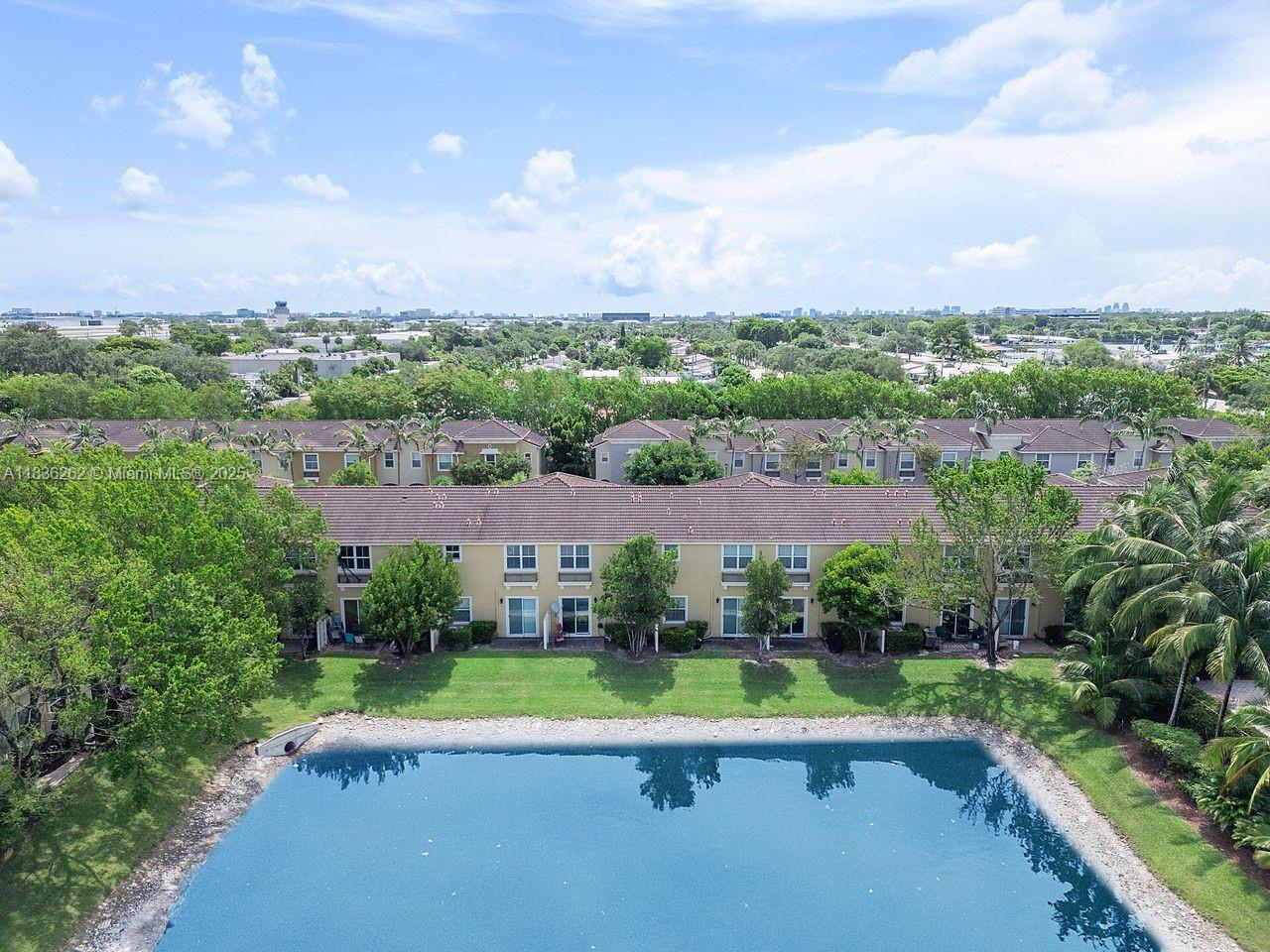 2851 Prospect Road, Unit 1306 Tamarac, FL 33309 - Photo 35 of 39 an aerial view of residential houses with outdoor space and city view