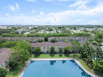 a view of a backyard with swimming pool