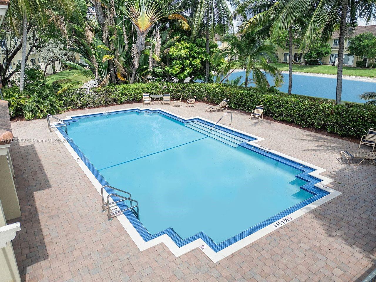 2851 Prospect Road, Unit 1306 Tamarac, FL 33309 - Photo 38 of 39 a view of a backyard with swimming pool
