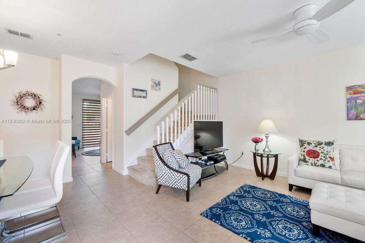 2851 Prospect Road, Unit 1306 Tamarac, FL 33309 - Photo 4 of 39 a living room with furniture and a fireplace