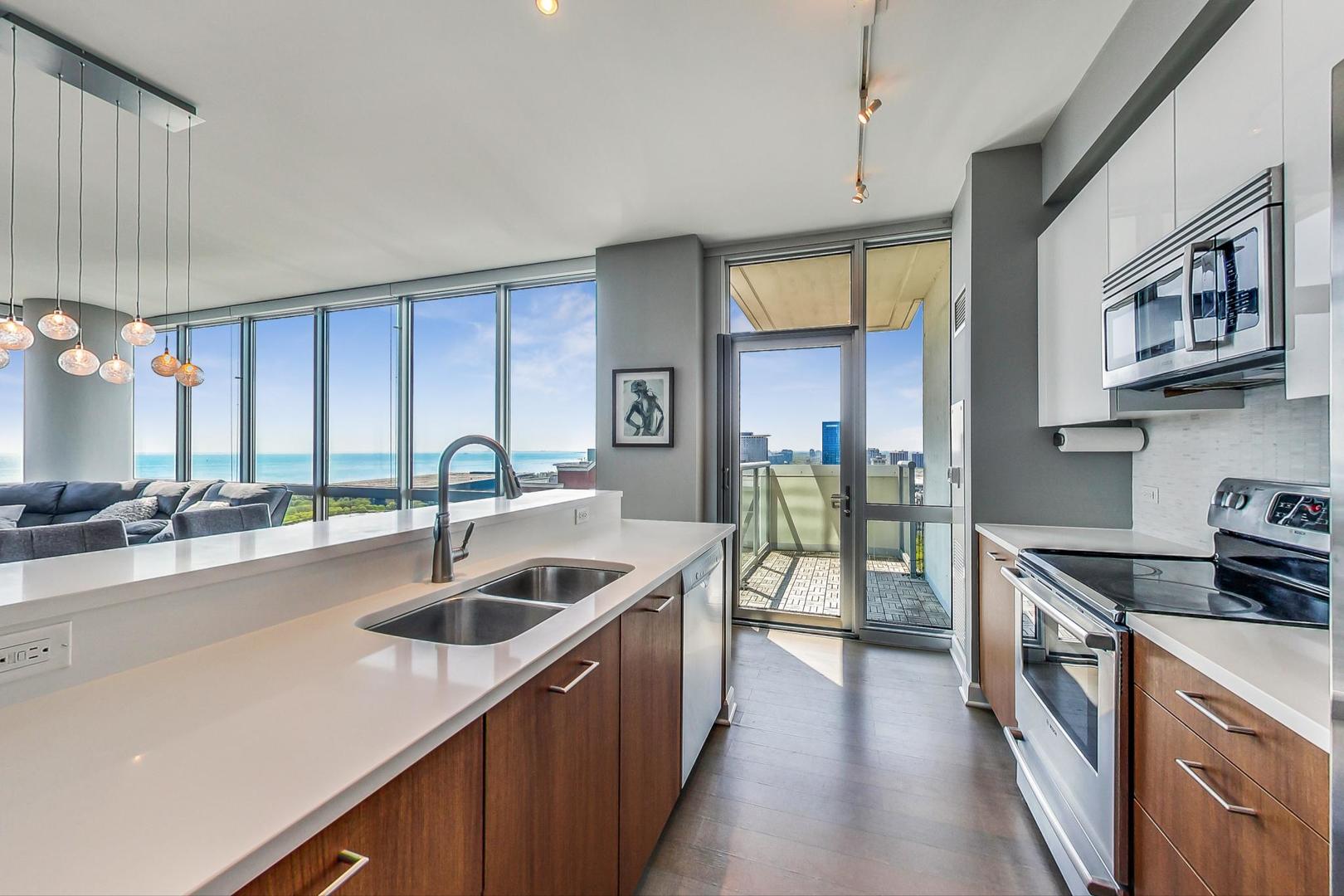 Undisclosed Address Chicago, IL 60616 - Photo 12 of 31 a kitchen with counter top space a sink and a stove