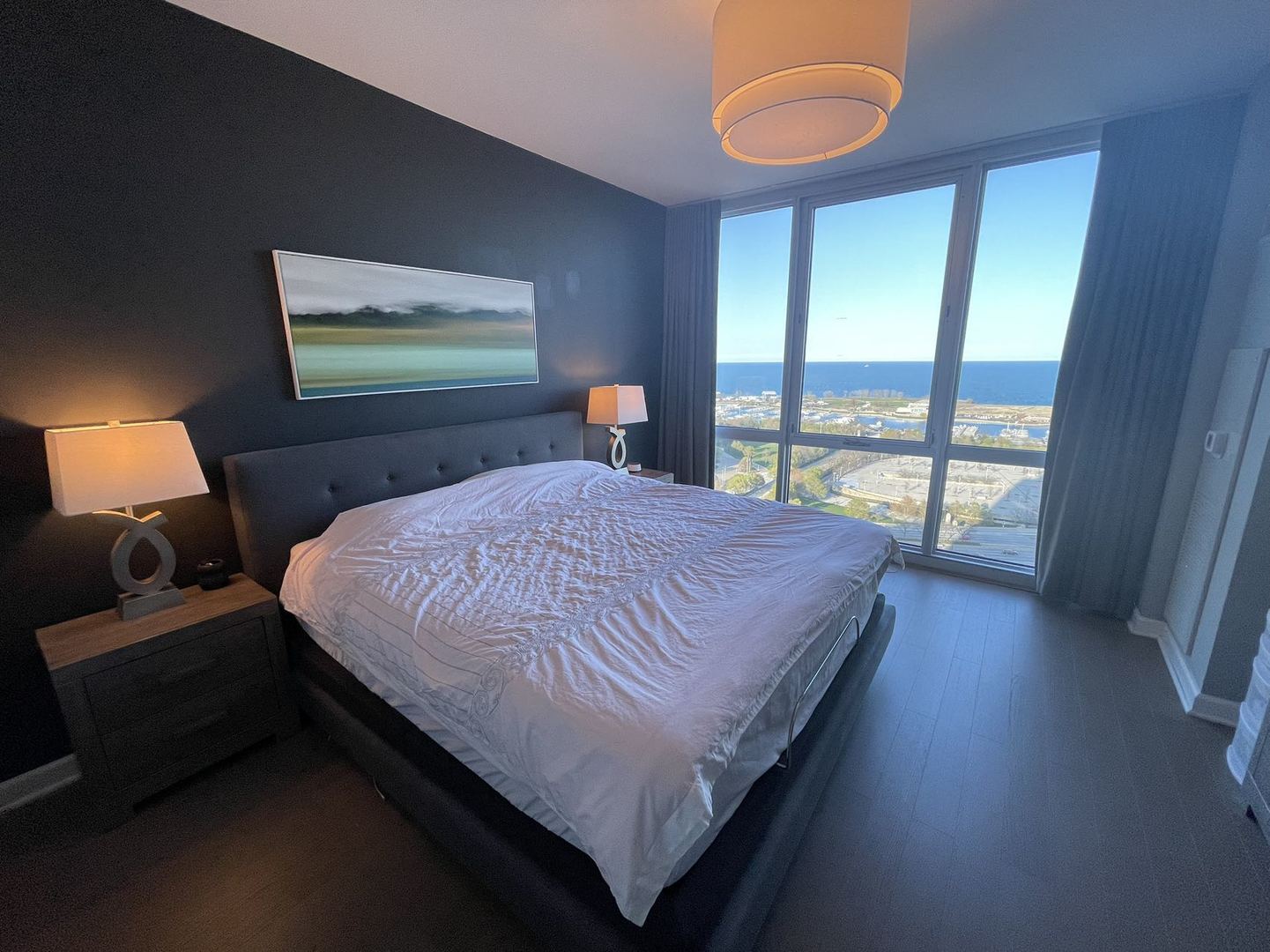 Undisclosed Address Chicago, IL 60616 - Photo 13 of 31 a bedroom with a bed and a large window