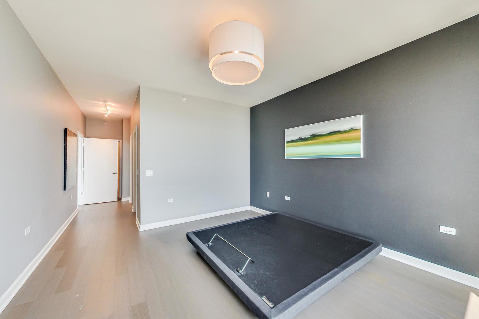 Undisclosed Address Chicago, IL 60616 - Photo 15 of 31 an empty room with wooden floor and windows