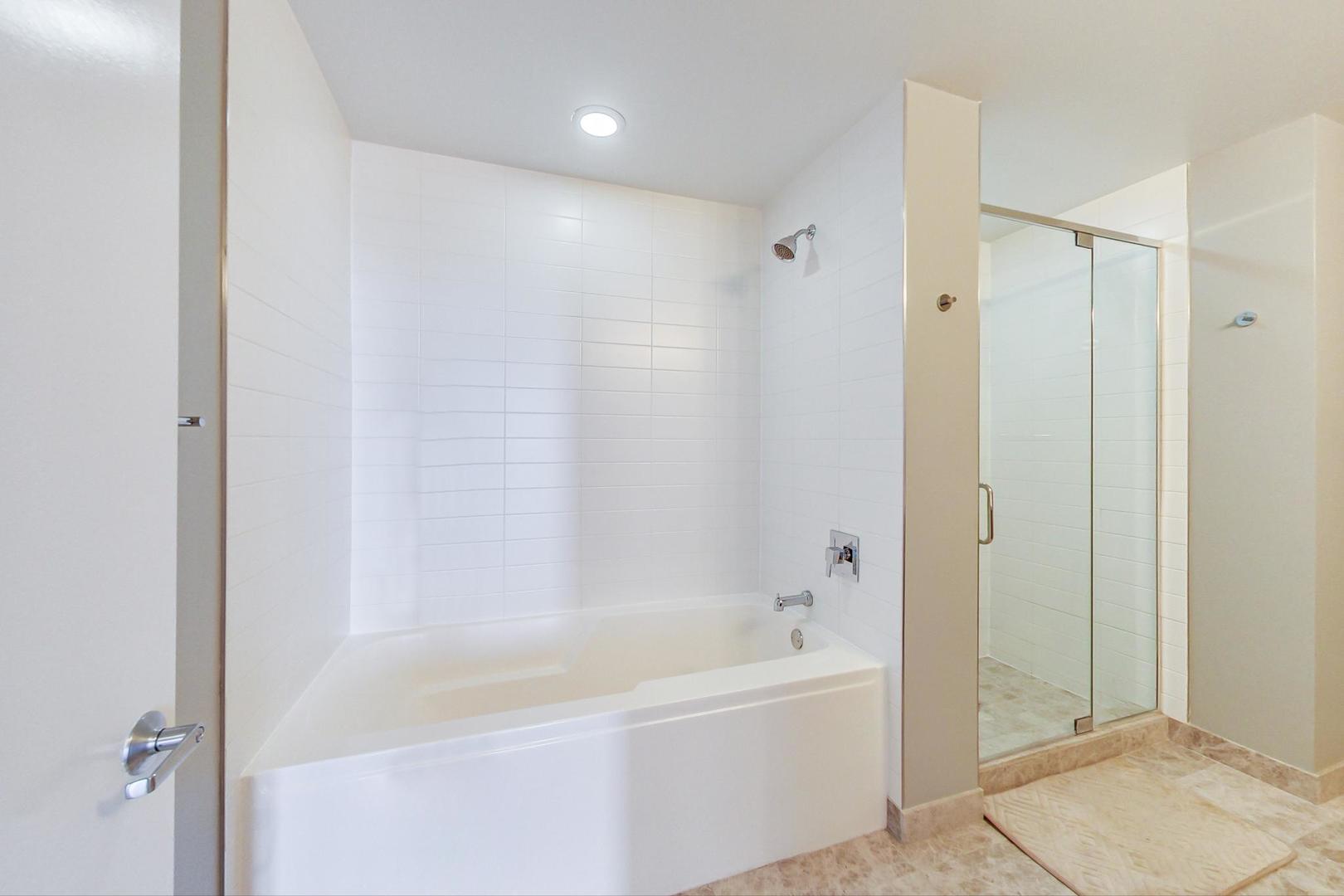 Undisclosed Address Chicago, IL 60616 - Photo 19 of 31 a bathroom with a bathtub and a shower