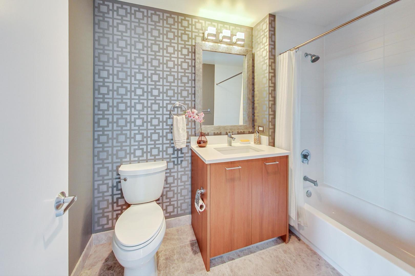 Undisclosed Address Chicago, IL 60616 - Photo 21 of 31 a bathroom with a toilet sink and mirror