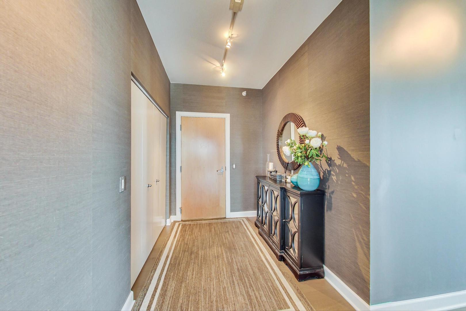 Undisclosed Address Chicago, IL 60616 - Photo 5 of 31 a view of hallway with wooden floor