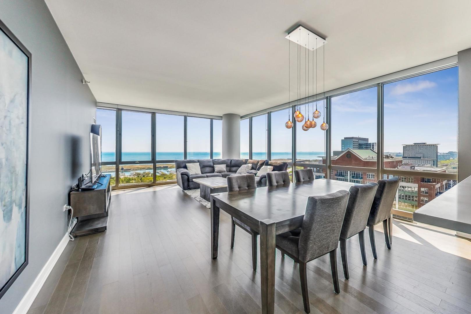 Undisclosed Address Chicago, IL 60616 - Photo 6 of 31 a dining room with furniture a chandelier and wooden floor