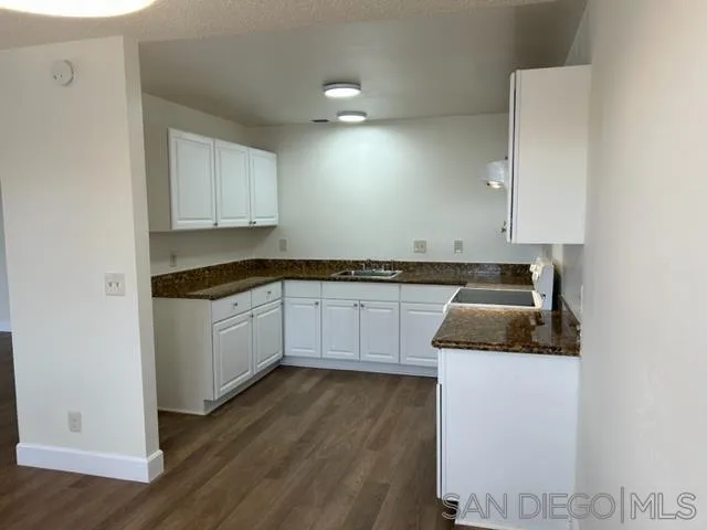 1604 Montecito Road, Unit 10 Ramona, CA 92065 - Photo 17 of 45 a kitchen with granite countertop white cabinets and white appliances