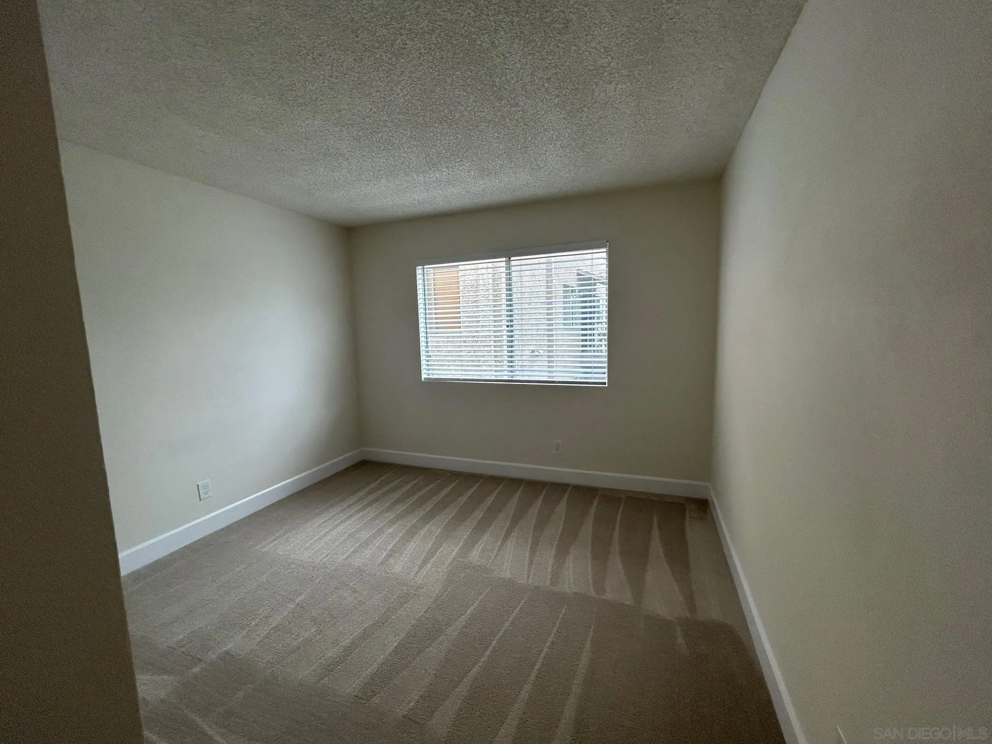 1604 Montecito Road, Unit 10 Ramona, CA 92065 - Photo 28 of 45 an empty room with a window