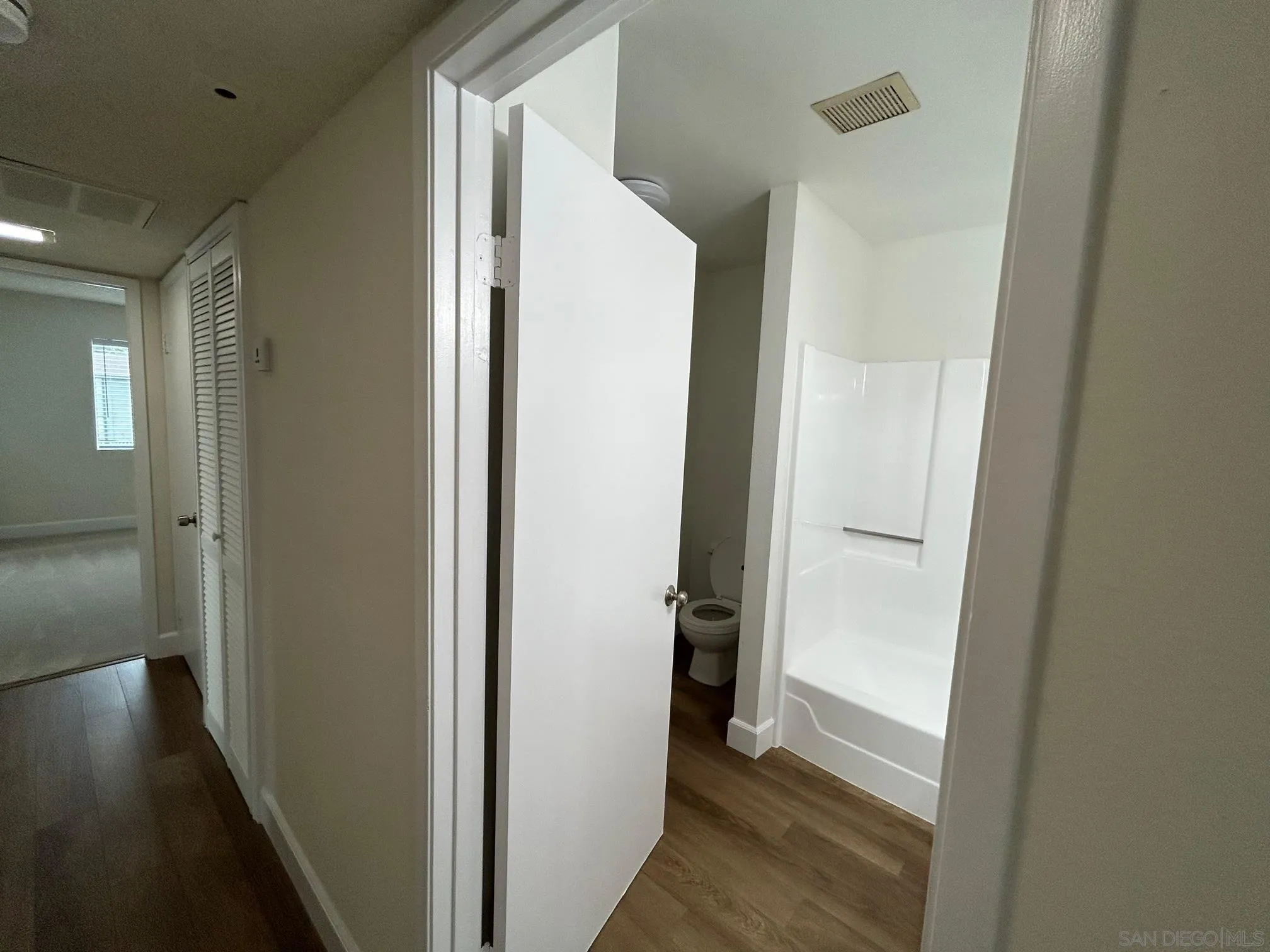 1604 Montecito Road, Unit 10 Ramona, CA 92065 - Photo 29 of 45 a view of a hallway with wooden floor