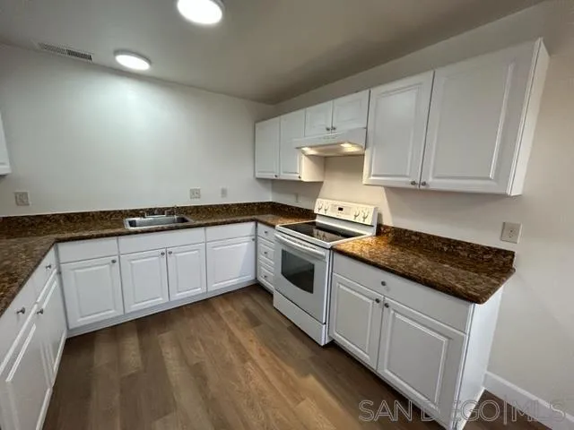 1604 Montecito Road, Unit 10 Ramona, CA 92065 - Photo 3 of 45 a kitchen with granite countertop white cabinets and white appliances