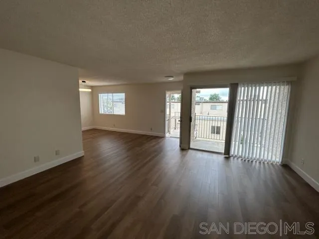 1604 Montecito Road, Unit 10 Ramona, CA 92065 - Photo 5 of 45 an empty room with wooden floor and windows