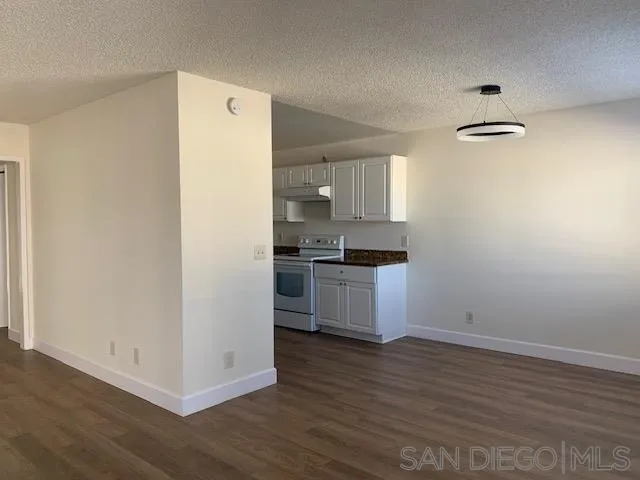 1604 Montecito Road, Unit 10 Ramona, CA 92065 - Photo 9 of 45 a kitchen with a refrigerator and a stove top oven