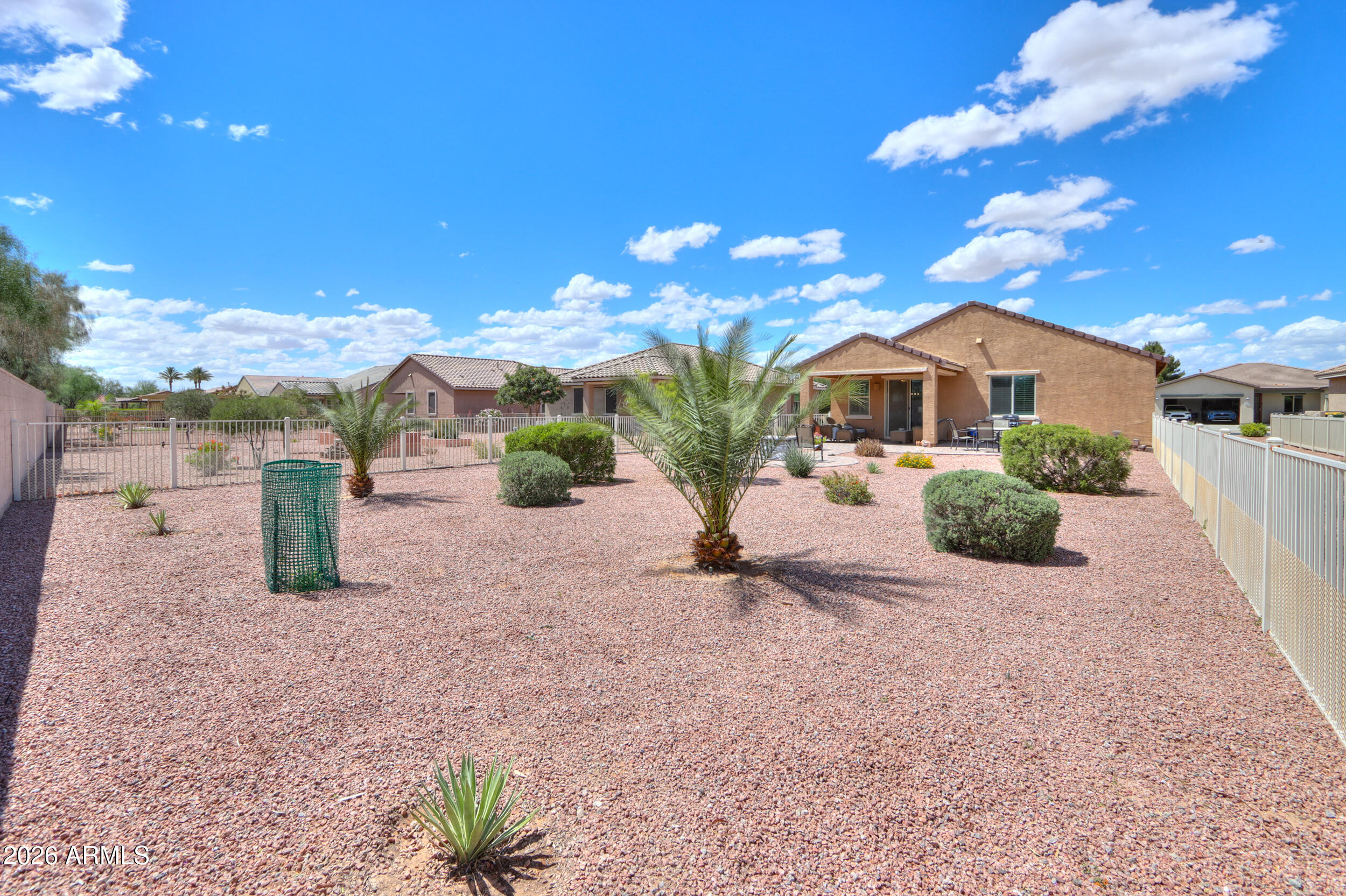 42085 West Cribbage Road Maricopa, AZ 85138 - Photo 32 of 35 a view of a house with a yard
