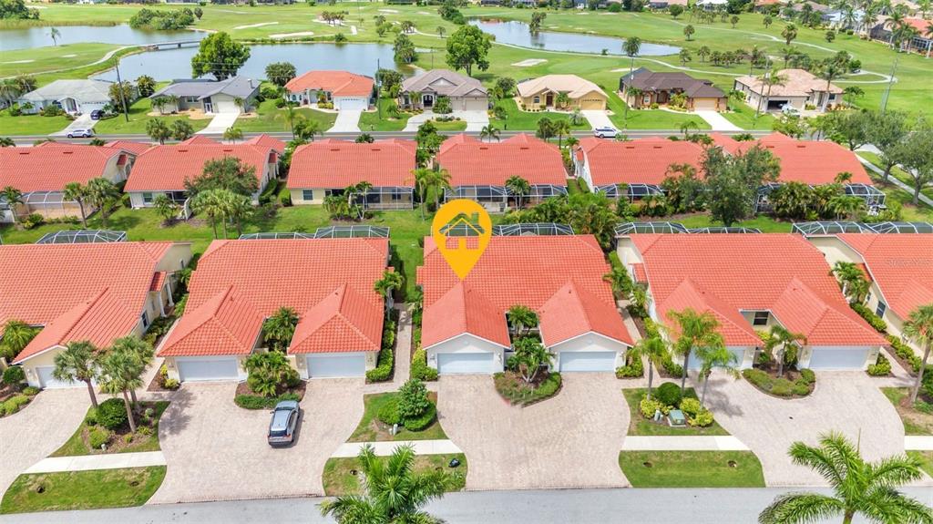 3715 Albacete Circle, Unit 93 Punta Gorda, FL 33950 - Photo 2 of 32 an aerial view of residential houses with outdoor space