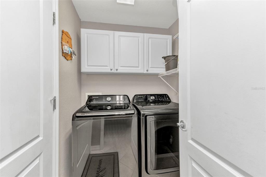 3715 Albacete Circle, Unit 93 Punta Gorda, FL 33950 - Photo 24 of 32 a kitchen with a stove and a refrigerator