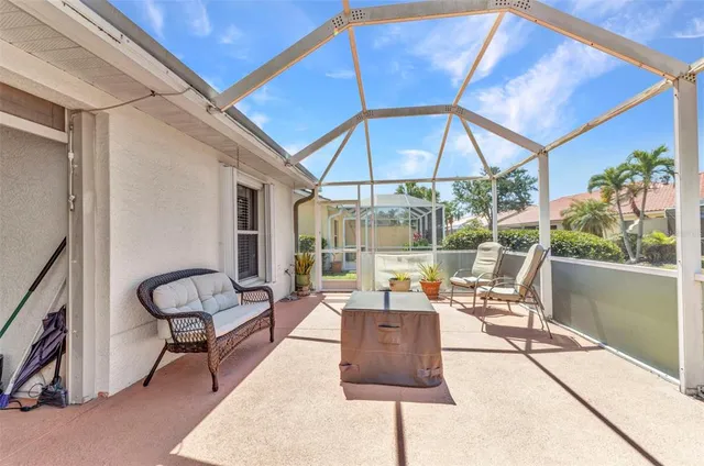 a outdoor space with patio the couches and pool table with chairs