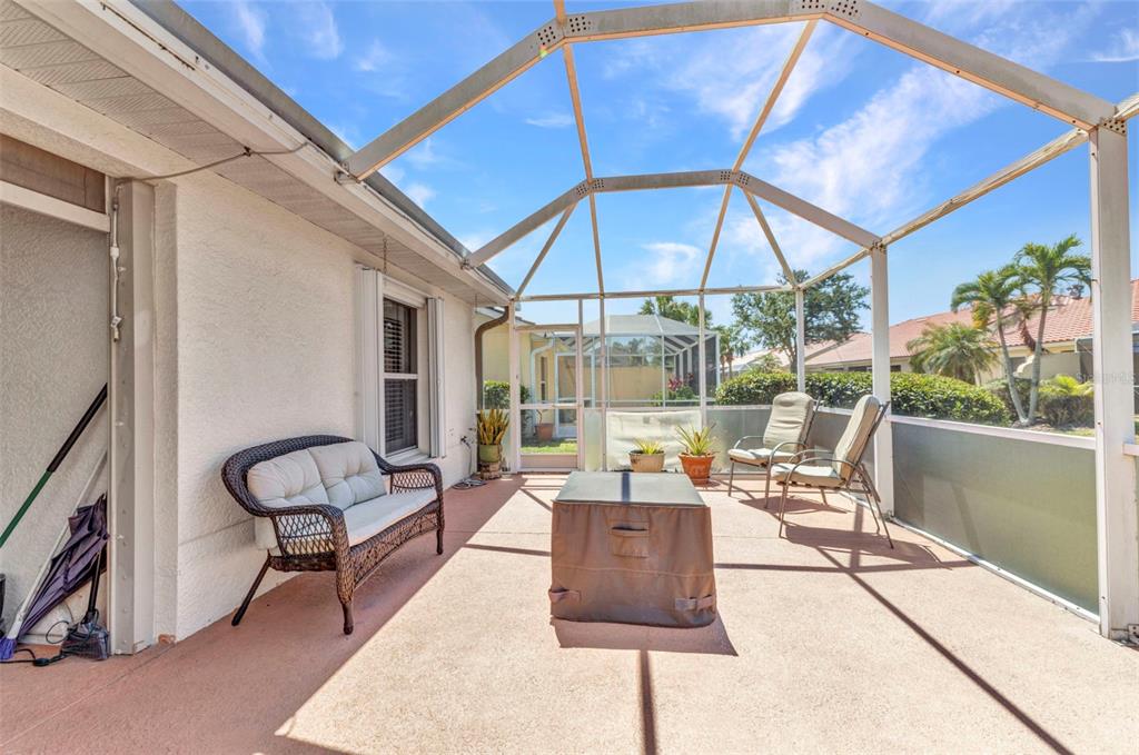3715 Albacete Circle, Unit 93 Punta Gorda, FL 33950 - Photo 26 of 32 a outdoor space with patio the couches and pool table with chairs