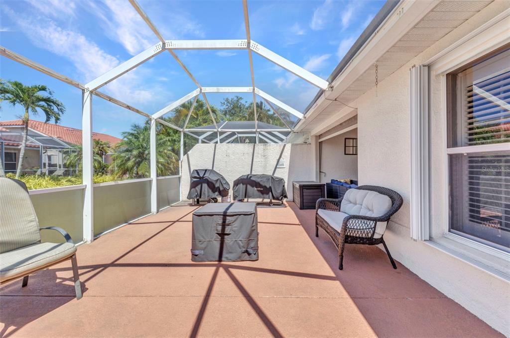 3715 Albacete Circle, Unit 93 Punta Gorda, FL 33950 - Photo 27 of 32 a living room with furniture a table and chairs