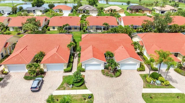 an aerial view of house with yard